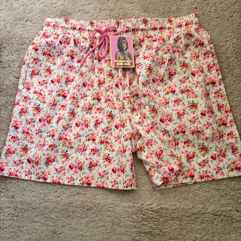 Strawberry Milk Mob Men’s Floral Swim Trunks in White and Pink